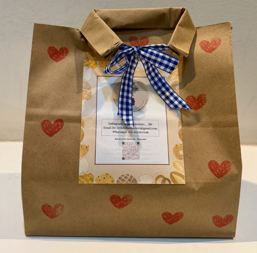Kraft gift bag with hand-stamped hearts, ribbon-tied
