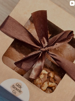 Close-up of a satin bow on a kraft brownie box